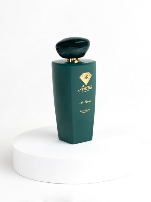 Amiir Scents Al Fatena extrait de parfum in jade green bottle on white background