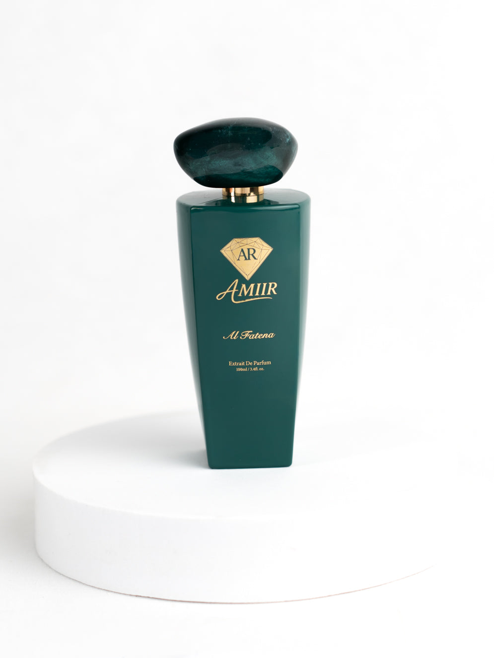 Amiir Scents Al Fatena extrait de parfum in jade green bottle on white background
