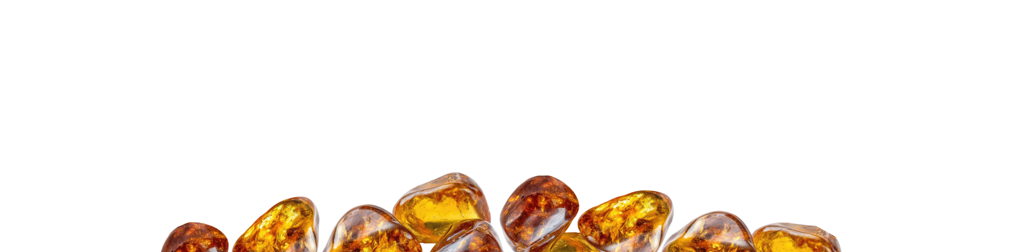 Row of amber-colored gemstones on a white background
