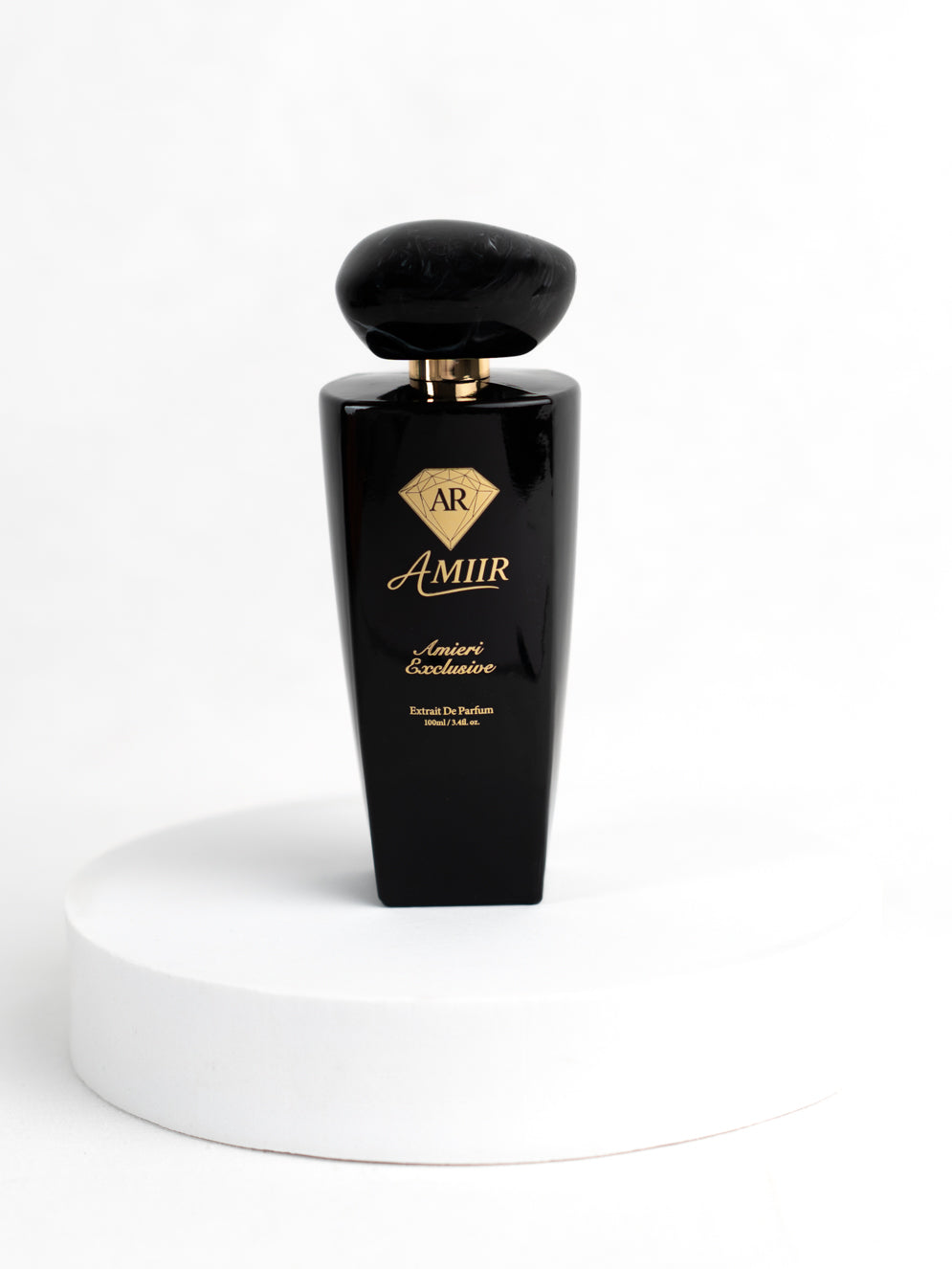 Amiir Scents Amieri Exclusive extrait de parfum in black bottle with golden accents on white background