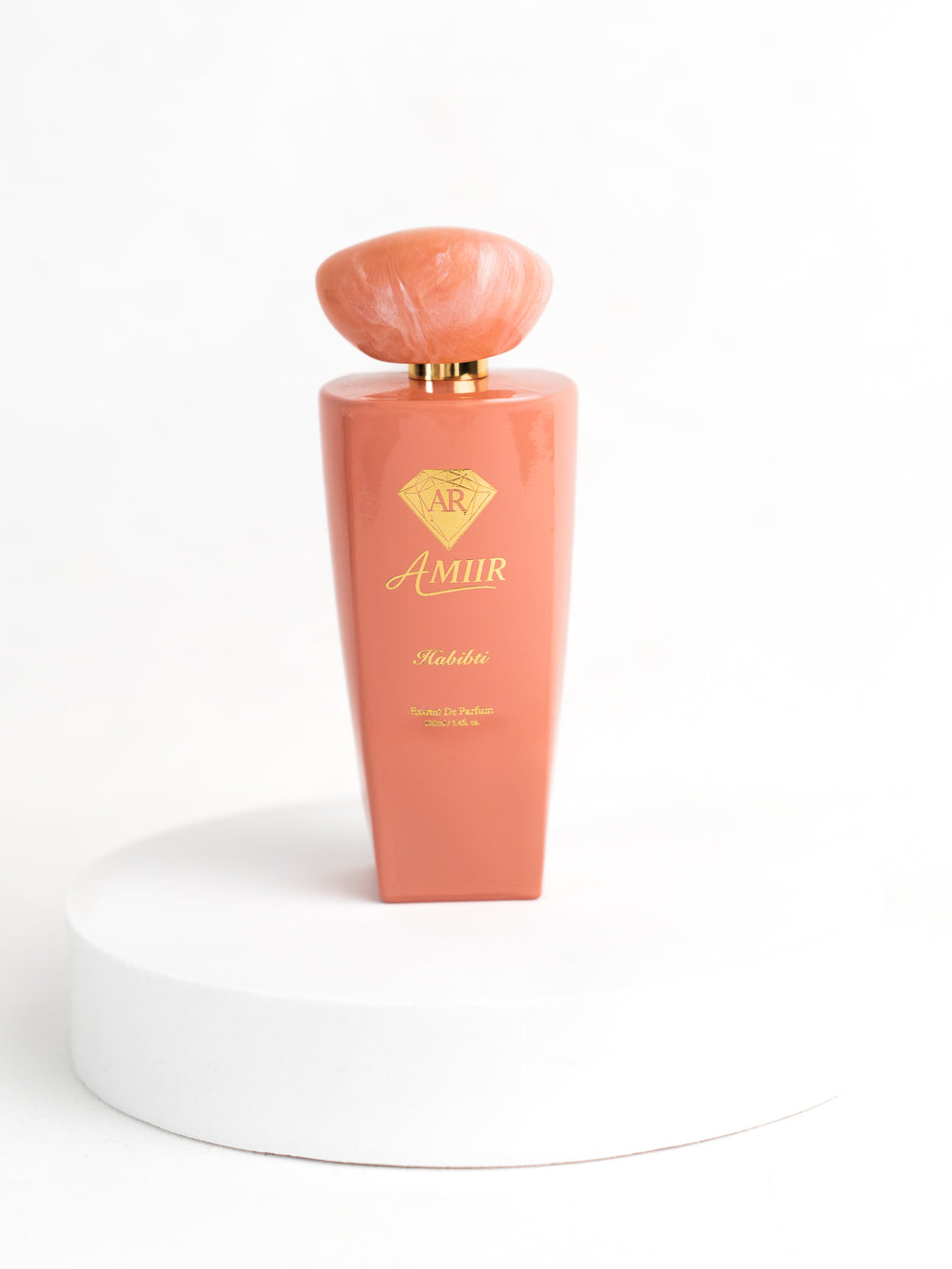 Amiir Scents Habibti extrait de parfum in coral-colored bottle on white background