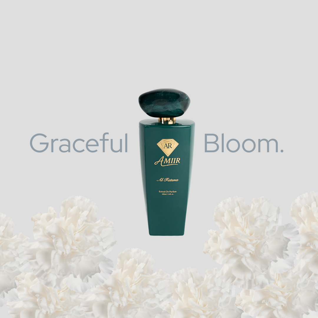 Mobile version Al Fatena product shot "Graceful Bloom" text on a light grey background. The Al Fatena bottle in deep green is centered, surrounded by soft white flower petals at the base. Minimal and elegant composition.