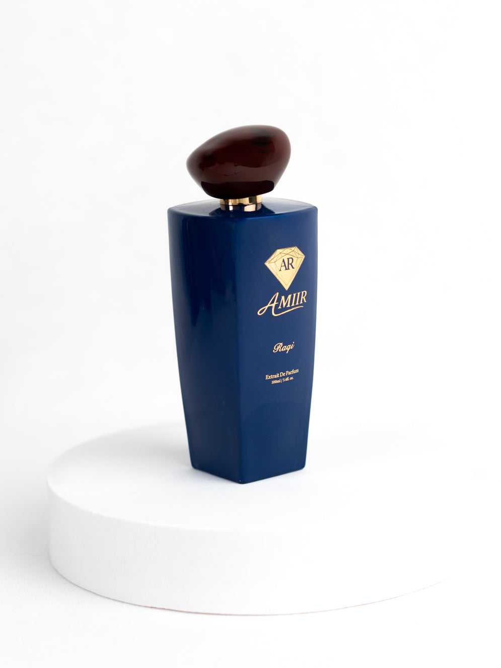 Amiir Scents Raqi extrait de parfum in blue bottle with golden accents on white background