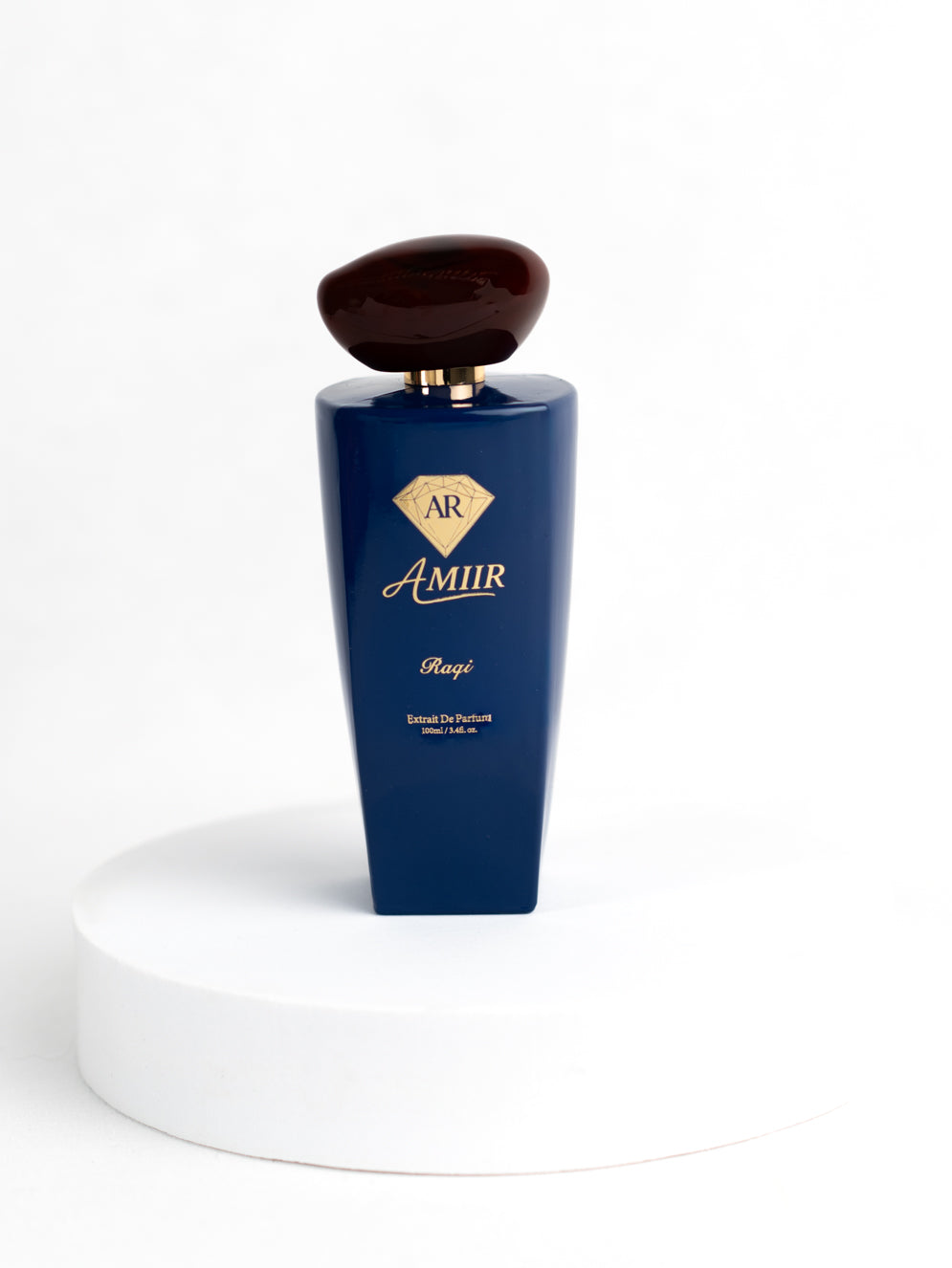 Amiir Scents Raqi extrait de parfum in blue bottle with golden accents on white background